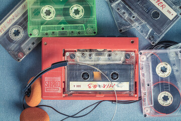 Classic audio cassette with headphones and player