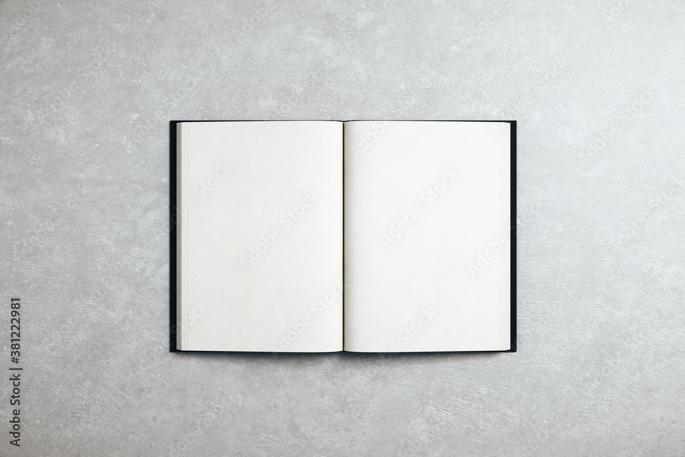 Poster abstract open white book standing on concrete table.