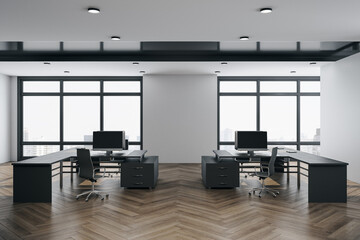 Minimalistic coworking office interior with furniture, computers and city view.