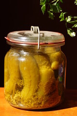 Glass retro jar, filled with vegetables in salted marinade.