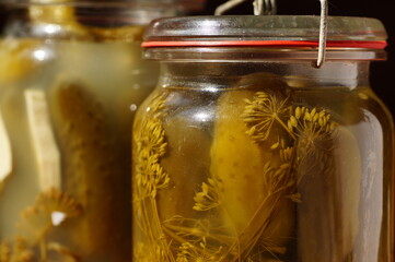 Glass retro jar, filled with vegetables in salted marinade.