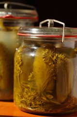 Pickled cucumbers with dill in a glass jar