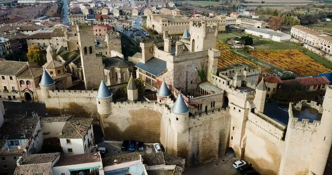 Picturesque autumn landscape of Olite with imposing medieval Palace of Kings of Navarre, Spain