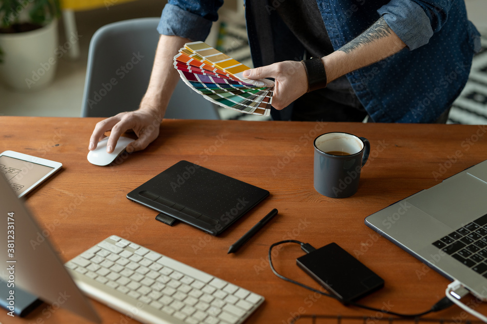 Wall mural hands of creative software developer or web designer with color palette