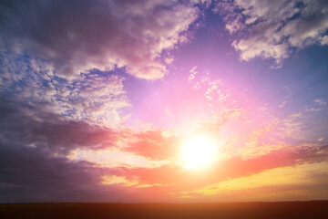 Sunset in Coudy Sky Over Field