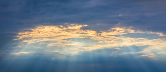 Sun Rays Through Cloudy Sky