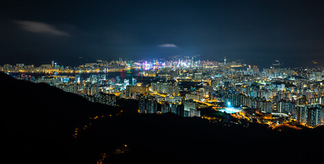 Aerial scenery panoramic view of Hong Kong from hight mountains with metropolitan bay Victoria Harbor modern cityscape, urban skyline buildings