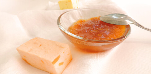 apricot jam in a glass bowl and fruit candy, delicious dessert       
