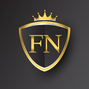 Initial logo letter FN with shield and crown Icon golden color isolated on black background, logotype design for company identity.