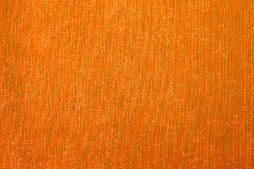 オレンジのニット地のテクスチャ