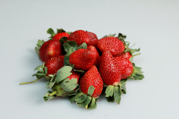 a pile of strawberries with hight key photography technique.