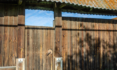 Gate and fence made of wood in the village.