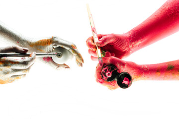 Modern art and process of creation. People coloring their hands in different colors. Concept of...