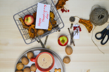 Cup of cocoa with cinnamon, apples, nuts top view, autumn warming drink, coffee with milk or cappuccino. Autumn organic food flat lay