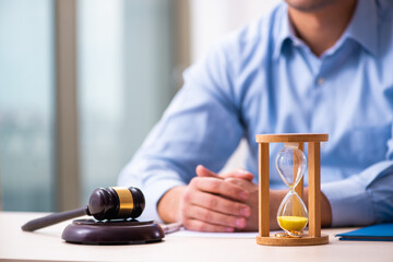 Young man in courthouse in divorcing concept