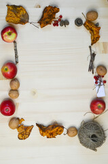Autumn background or banner, harvest apples, acorns, walnuts and fallen leaves top view, frame or card with copy space text