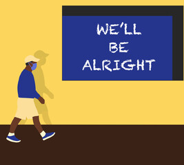 Black Lives Matters protesters man in blue shirt wearing face mask prevent himself from the outbreak walk pass yellow wall with "We'll be alright" at urban street.Human rights