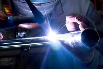 TIG welding of polished stainless steel pipe - 381256375
