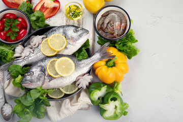 Raw dorado fish with vegetables.