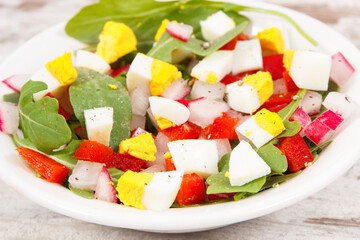 Fresh prepared salad in glass bowl, healthy nutrition concept