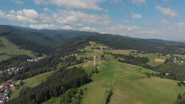 Flying backward from mountain Polom in Beskid Sadecki Mountains near village Rytro, Poland
