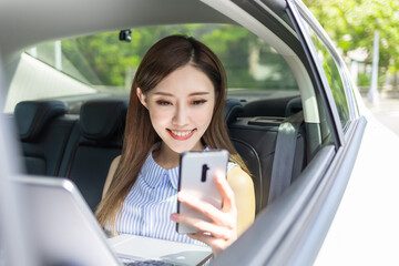 businesswoman use phone in car