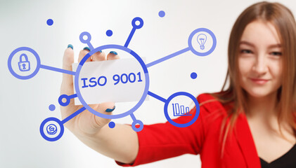 Business, Technology, Internet and network concept. Young businessman working on a virtual screen of the future and sees the inscription: ISO 9001