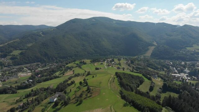 Flying over Beskid Sadecki Mountains in summer near village Rytro and Polom mountain, Poland