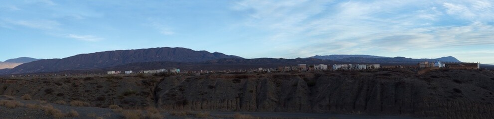 Culture and religion. Panorama view of an aboriginal cemetery very high in the mountains.The graveyard and tombs in the mountain summit at nightfall.