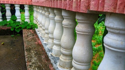 White balusters stone railing. stone balustrade railings. The cement railings with white color on the terrace.