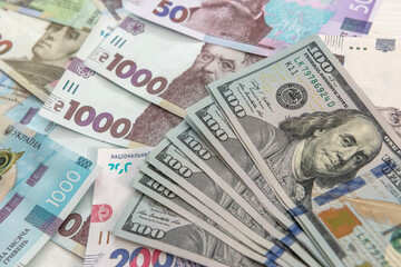 Background for design banknotes of usa dollars and ukrainian hryvnia