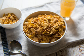 Close up of a bowl of cereal with condiments with use of selective focus.