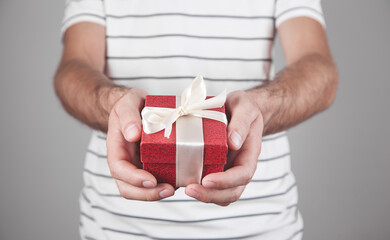 Man with gift box. Christmas. Surprise