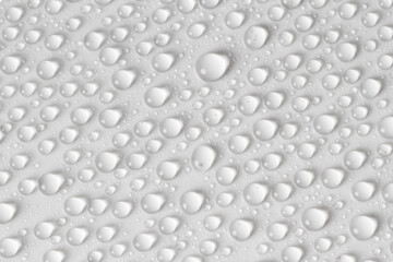 Water drops on light background. Top view. Closeup