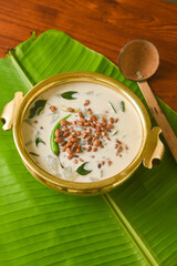 Onam Sadhya, Kerala vegetarian curry Olan a vegetable curry Kerala cuisine in South India on banana leaf. prepared from white gourd, lentil, coconut milk and ginger seasoned with coconut oil 