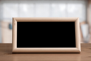 photo frame on the wooden table