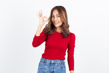 Fototapeta na wymiar Beautiful asian woman smiling with hand ok sign on a white isolated background