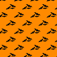 Halloween seamless pattern. Bats on orange background. Halloween concept