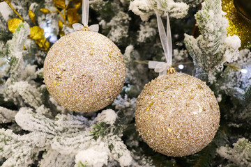 christmas composition. golden balls on the christmas tree. new year tree decorations. christmas background