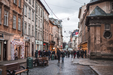 urban bustle movement of people in the city on the roads in cloudy weather