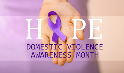 Woman with violet ribbon on color background, closeup. Domestic violence concept