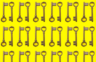 Many old keys on color background