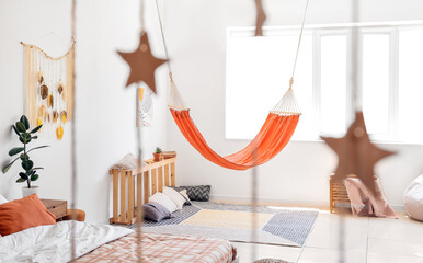 Interior of living bedroom with stylish hammock