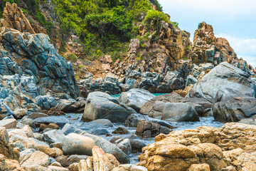 Beauty panorama edged shabby sea cliff cumulus cloud sky mountain island background. Gray brown stone rock texture vivid colour photo. Concept of geology, tourism after pandemic, power in nature