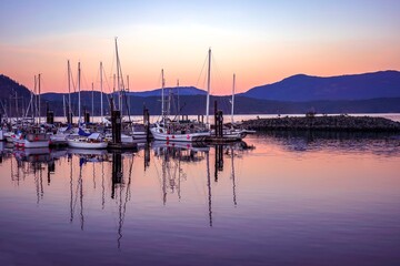 Fototapeta na wymiar Sailboats at marina at sunset - Cowichan Bay, Vancouver Island, British Columbia, Canada 