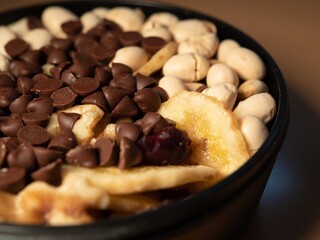 Healthy snack of nuts, chocolate chips, soy beans, banana chips