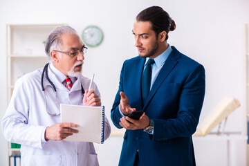 Male doctor and businessman discussing medical project