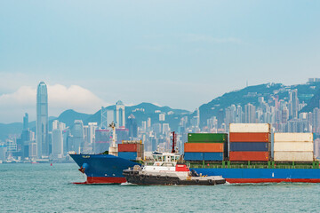 Cargo ship in Victoria Harbor of Hong Kong city