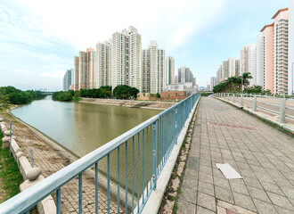 Naklejka premium High rise apartment building and road in residential district of Hong Kong city