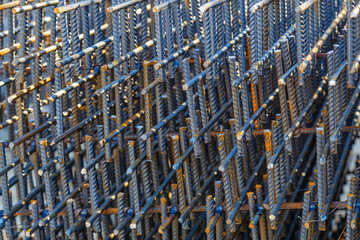 Obraz premium Industrial background. Rebar texture. Rusty rebar for concrete pouring. Steel reinforcement bars. Construction rebar steel work reinforcement. Closeup of Steel rebars.